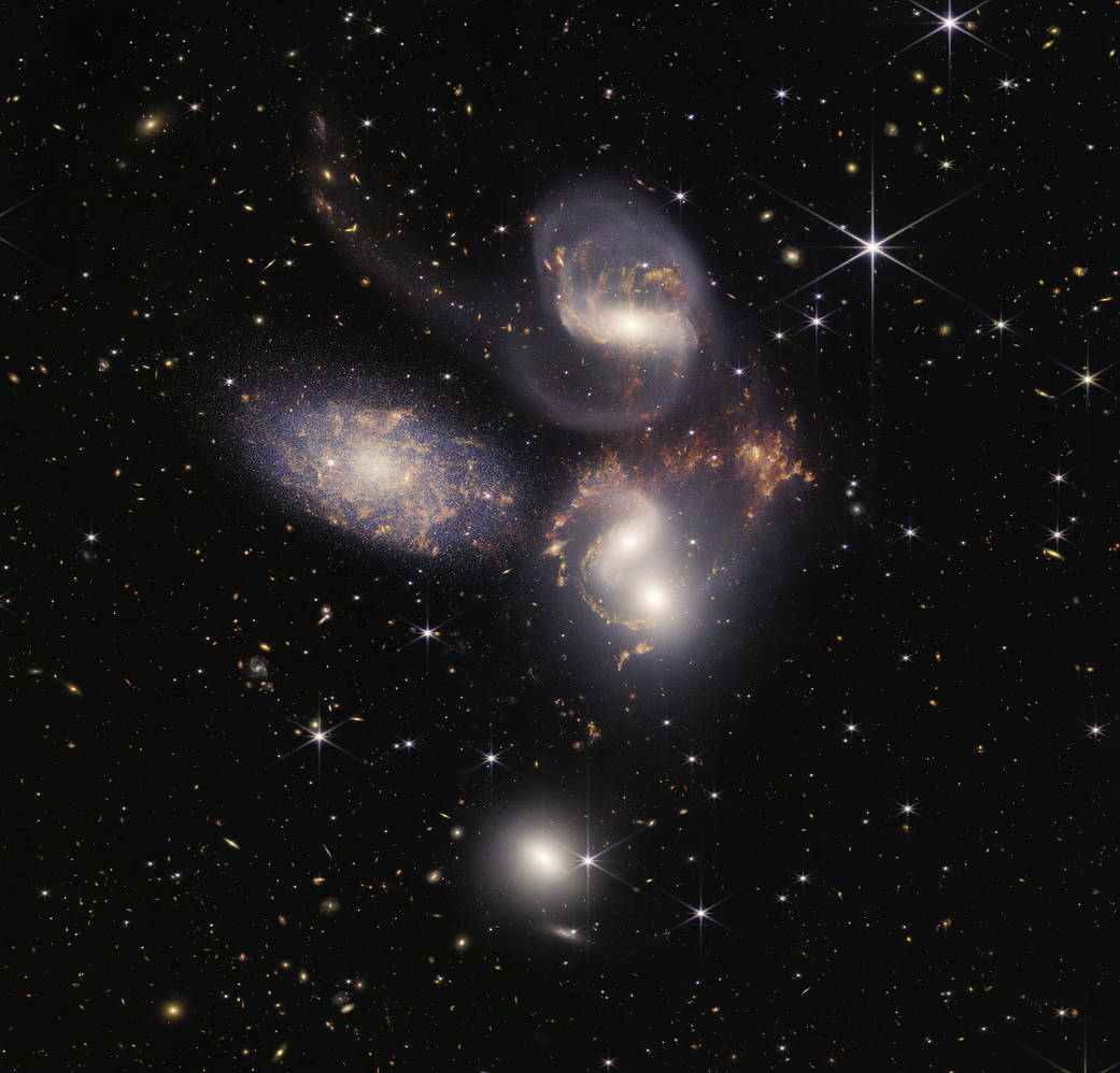 Stephan's Quintet (a visual grouping of 5 galaxies gives information about galaxy evolution & Black holes)